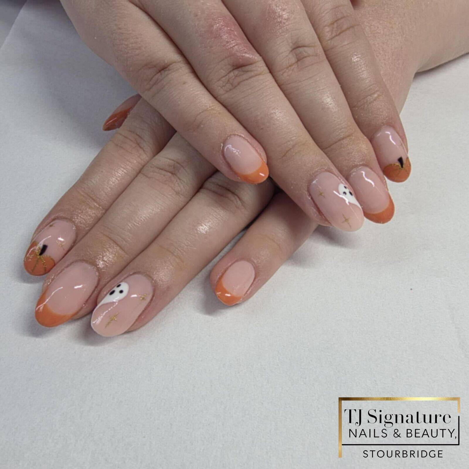 Halloween builder gel nails — nude base, pumpkin tips, and cute ghost details. Strong, durable, and perfect for growing natural nails. 🎃