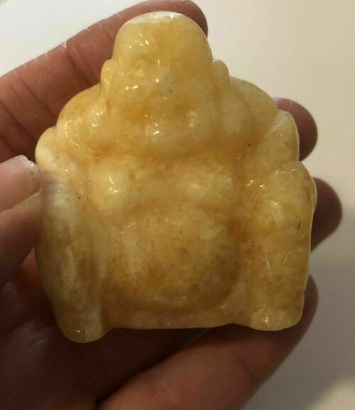 Orange calcite buddha