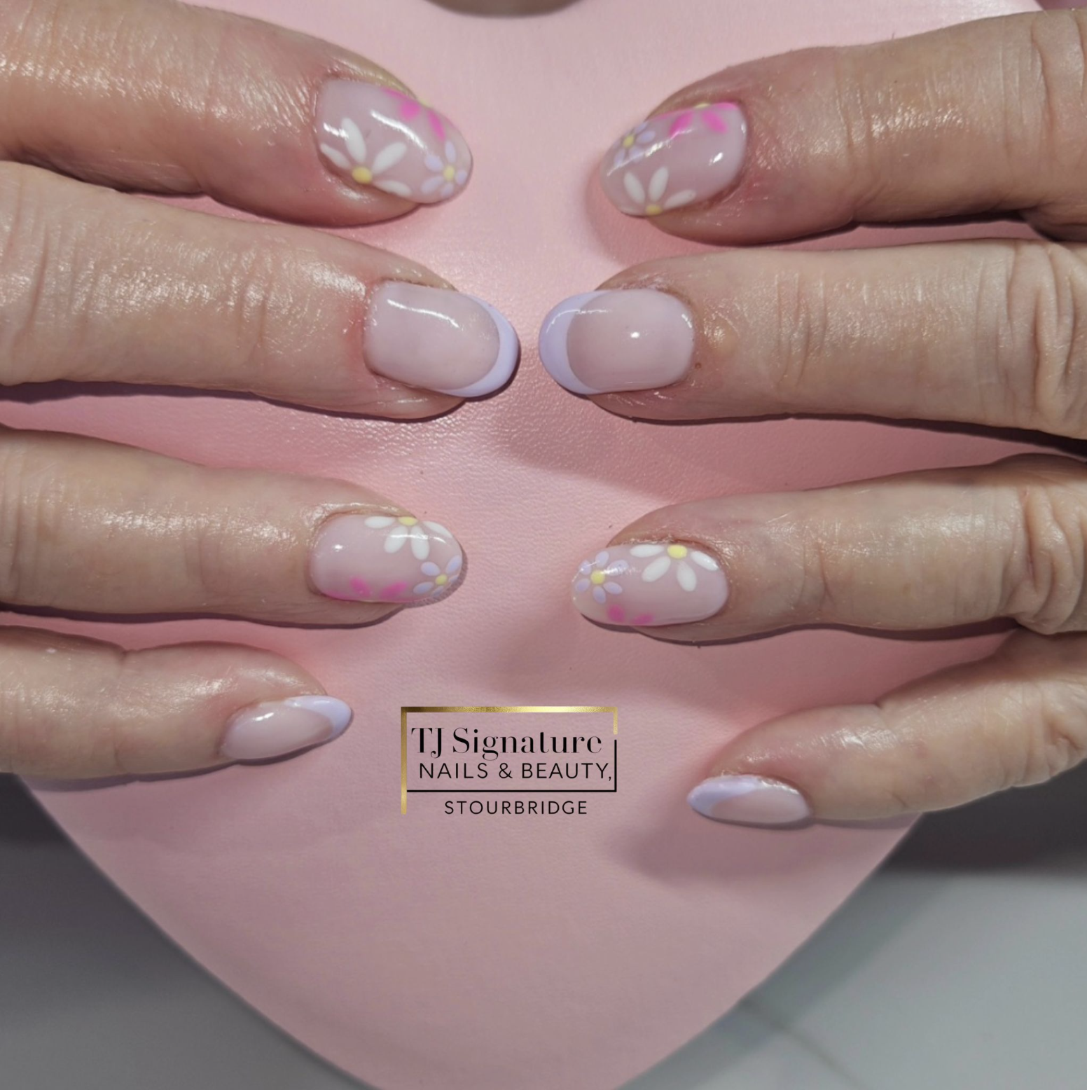Beautiful floral nails with a lilac French tip. Using O.P.I 'Put It In Neutral' as the base colour