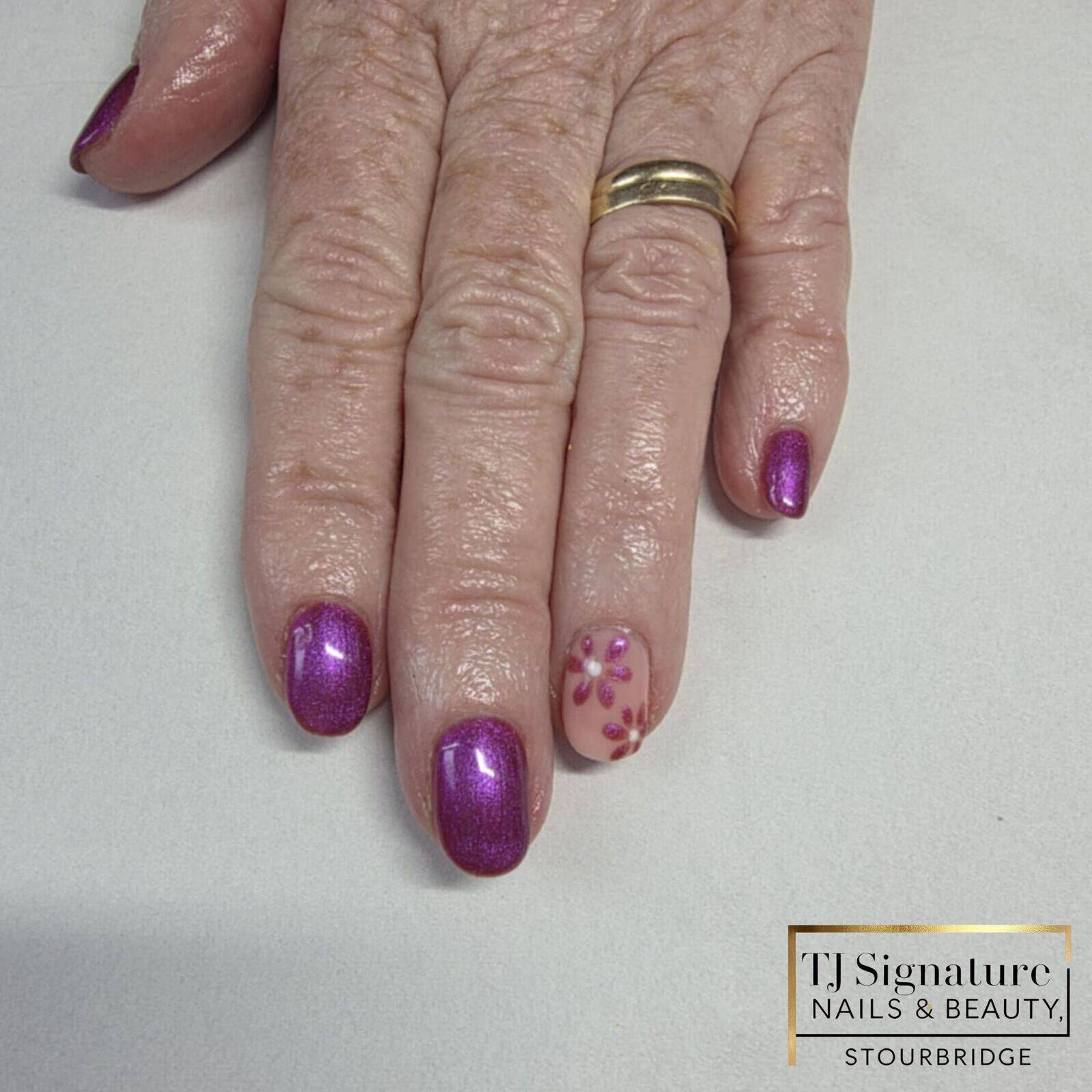 A rich, metallic purple with a soft nude floral accent — elegant, feminine, and full of subtle shimmer. Perfect for adding a pop of colour while keeping it classy.