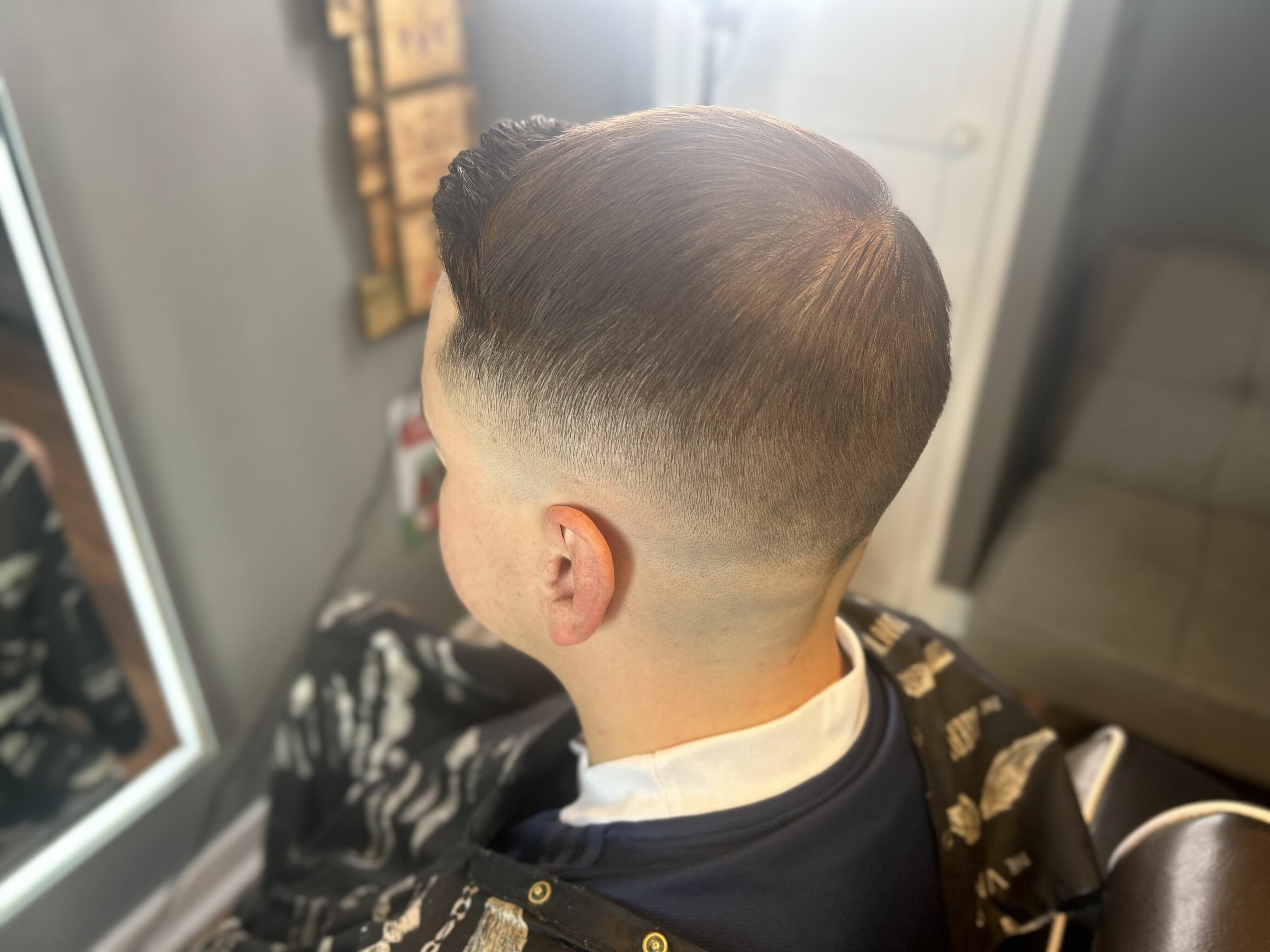 Drop fade with high quiff 