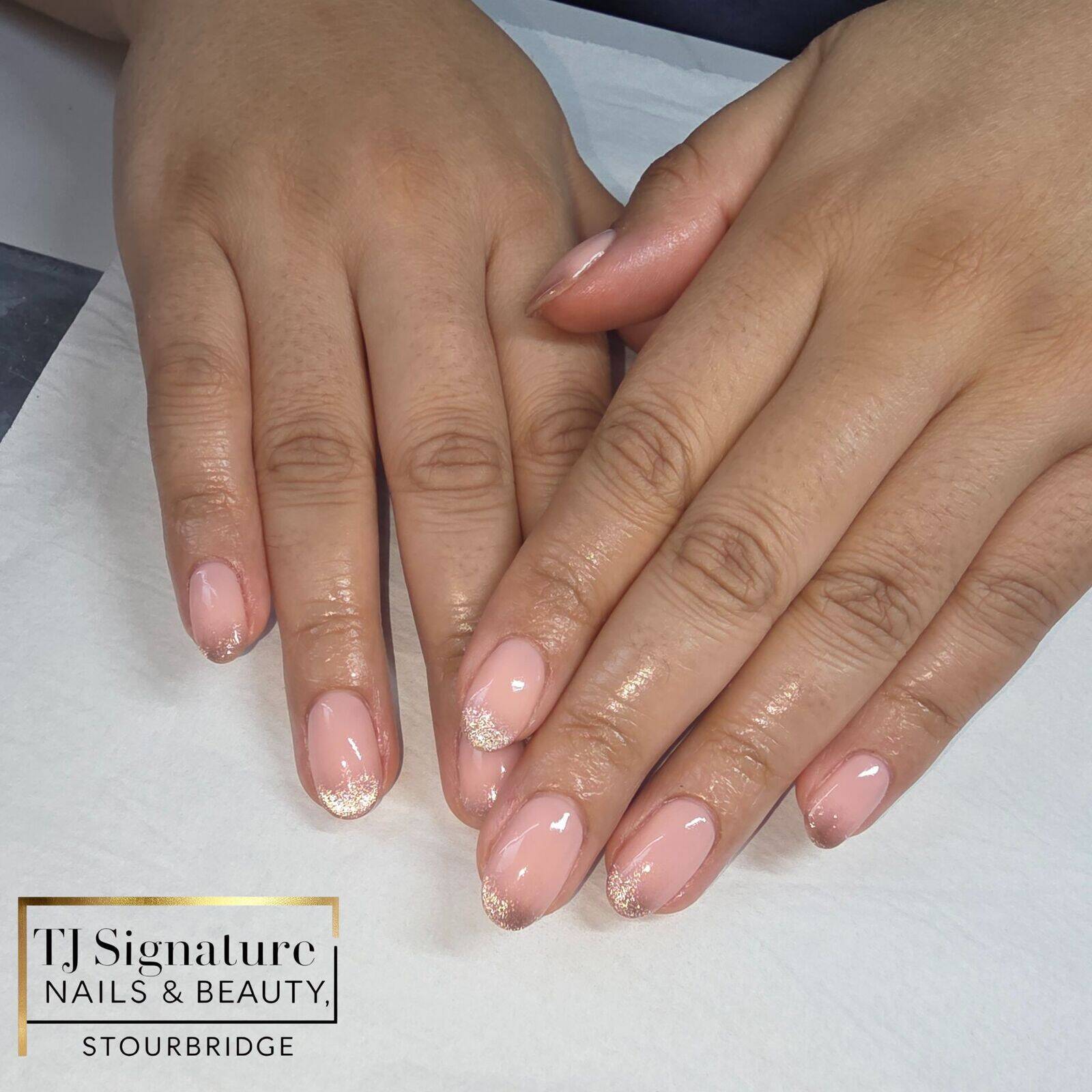 A soft blush pink finish with delicate gold glitter tips — elegant, timeless and perfect for those who love a clean, polished look with a subtle touch of sparkle.