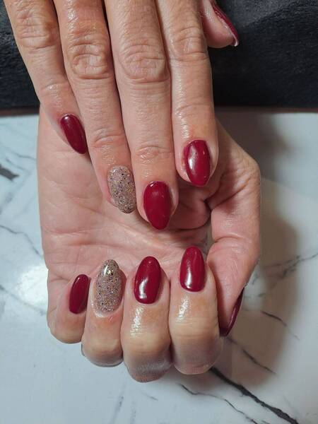 A deep red with a nude speckle glitter