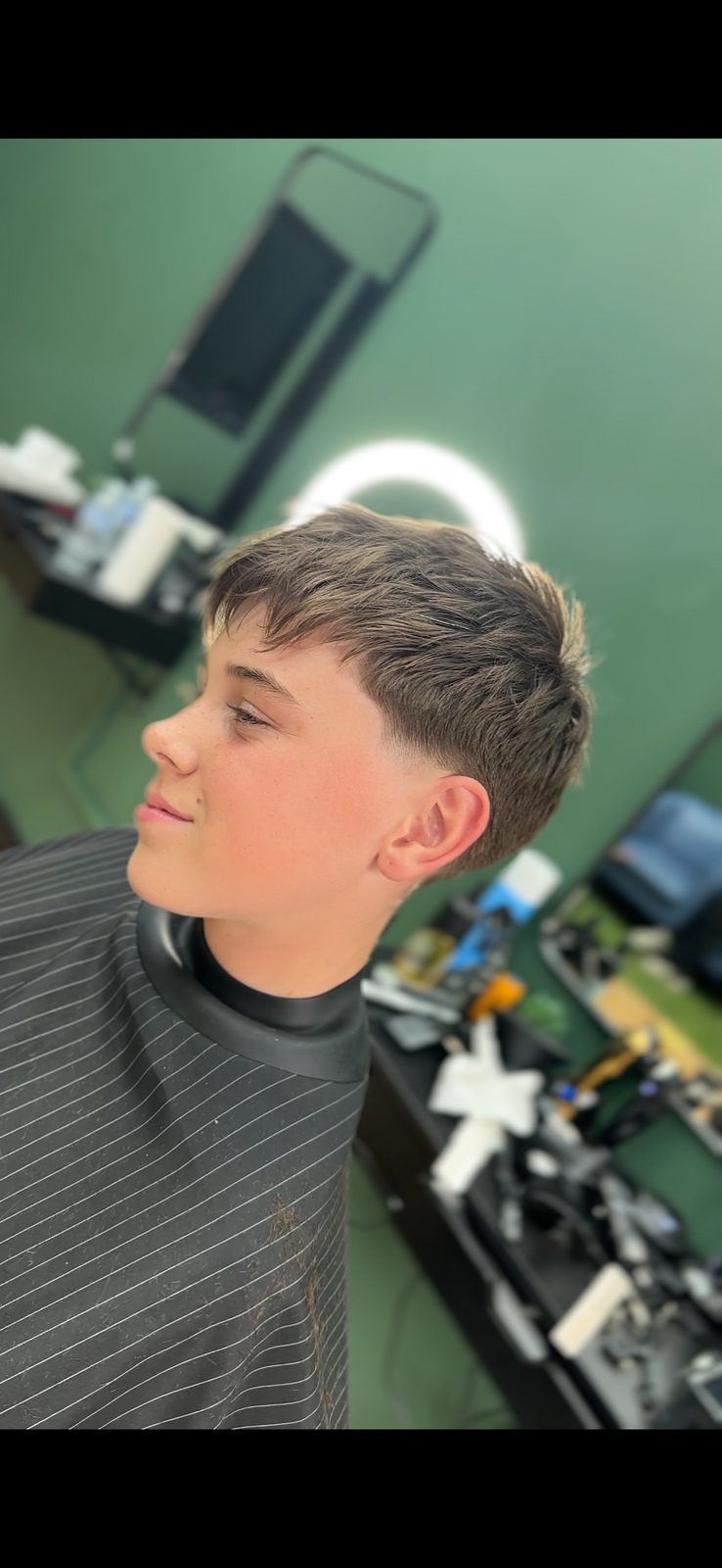 Taper fade with soft graduation for a natural, low-maintenance style — finished at RYZN Barbers Musselburgh