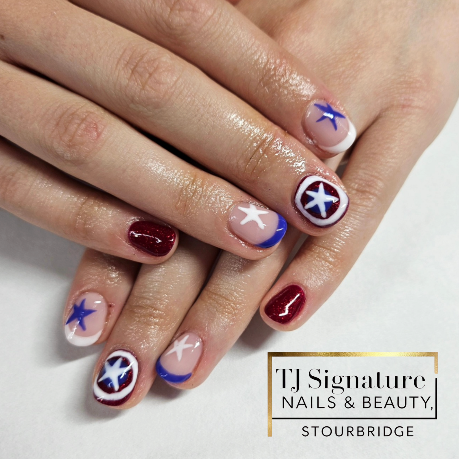 Channel your inner hero – Captain America-themed nail art.