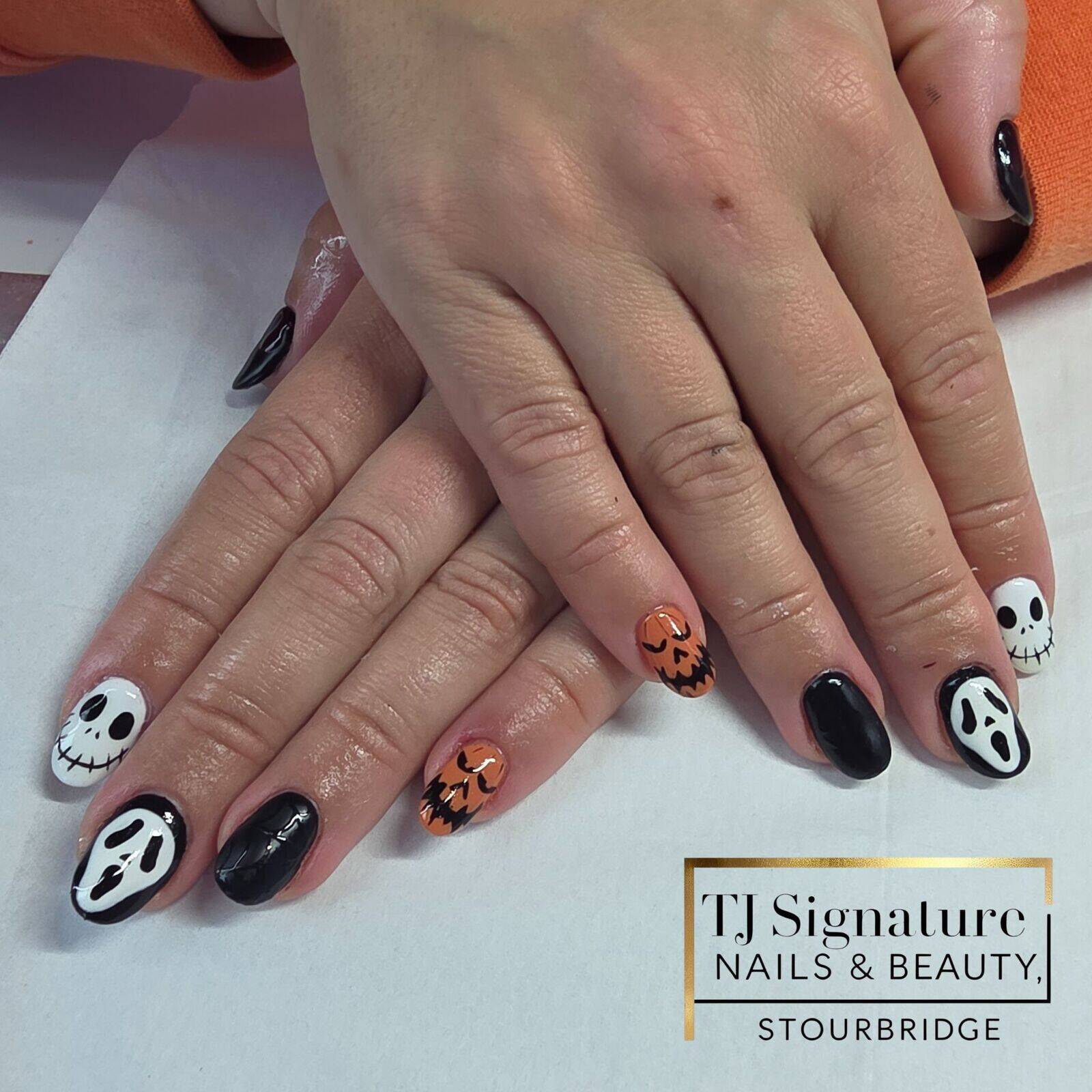 hand-painted Halloween designs — a sophisticated blend of deep blacks, glossy whites, and chic pumpkin tones.