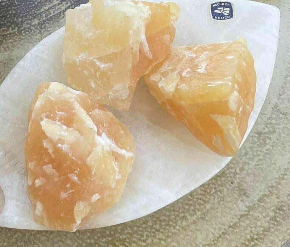 Raw orange calcite pieces
