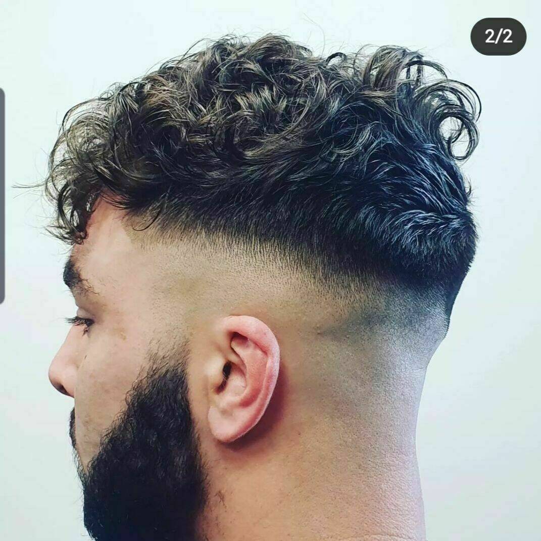 Skin fade with a perm done by Dan and Sharon