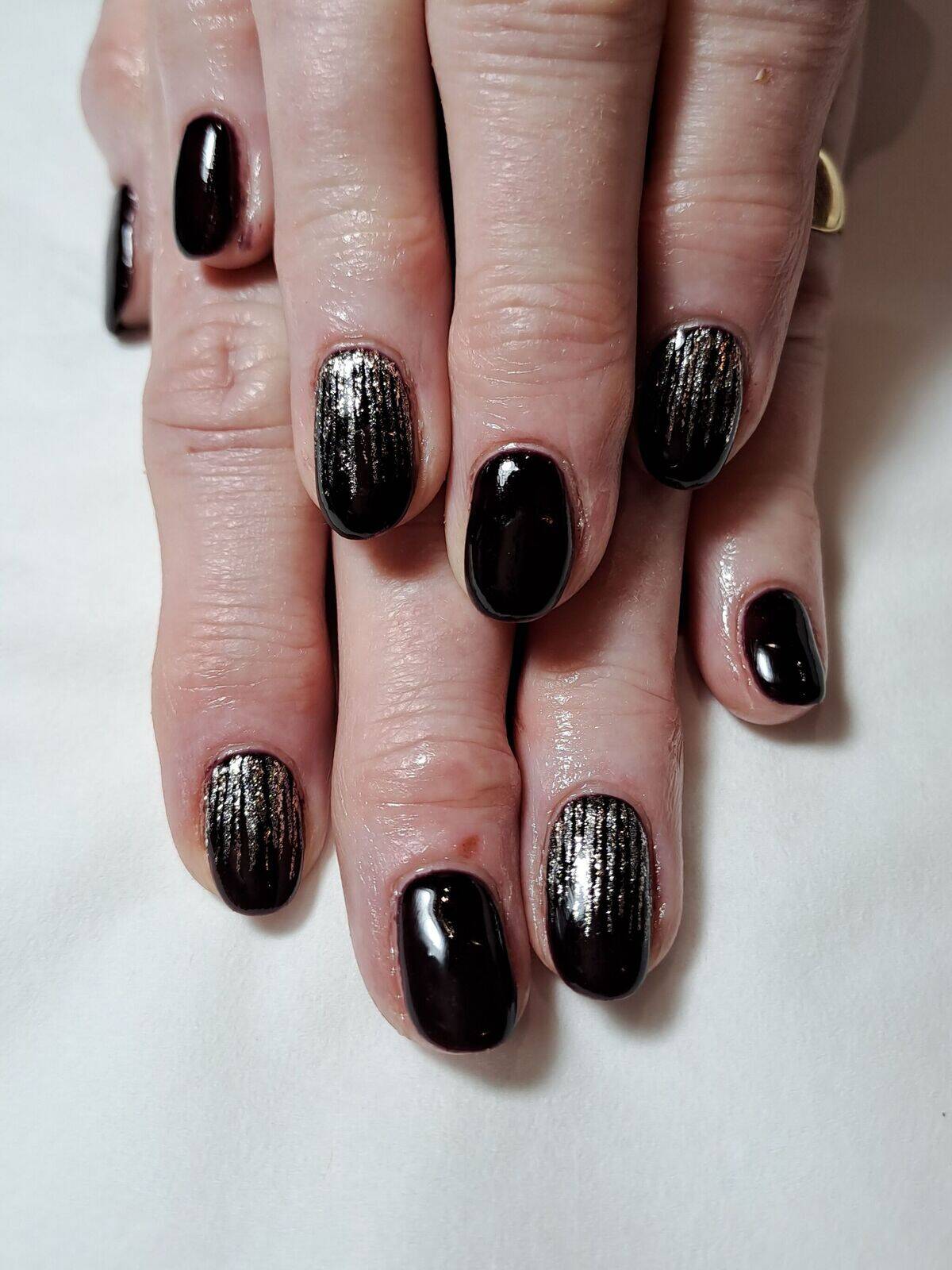 Black gel polish with a glitter rain fall