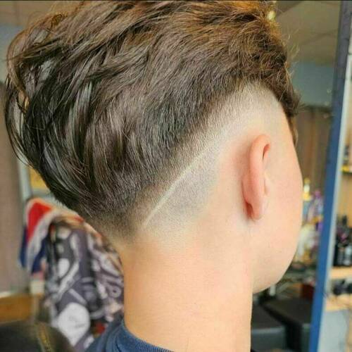 Dare to be different?? Ultimate low fade 'Z' cut into textured easy over crown and invisible fade to nape,signature stripe signifying....'You don't need to toe the line'💈