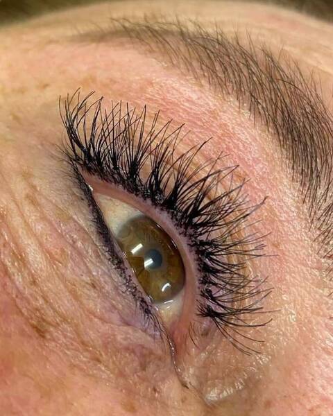 Cluster lashes placed on natural lashes up to 7 days wear