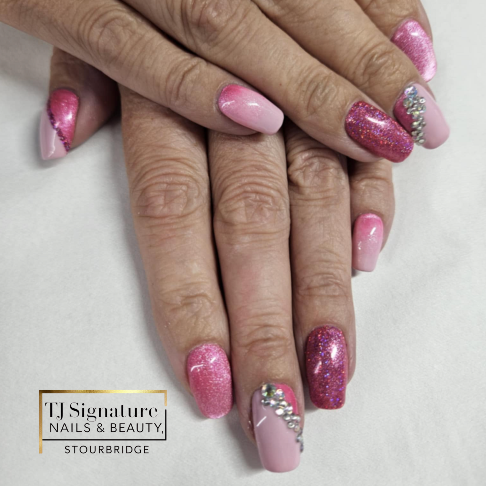 Gorgeous builder over natural nails with a pink cat eye effect, glitter, and crystals for extra sparkle ✨💅💖