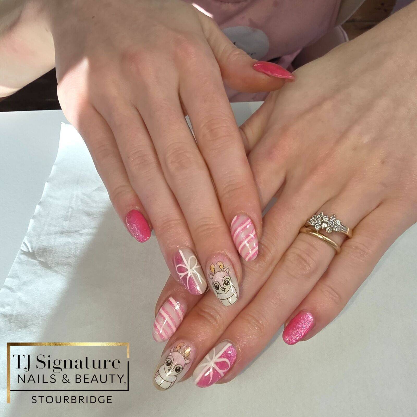 BIAB nails I created on myself, featuring soft pink tones, shimmering cat-eye accents, delicate sparkle, bows and a playful character detail.