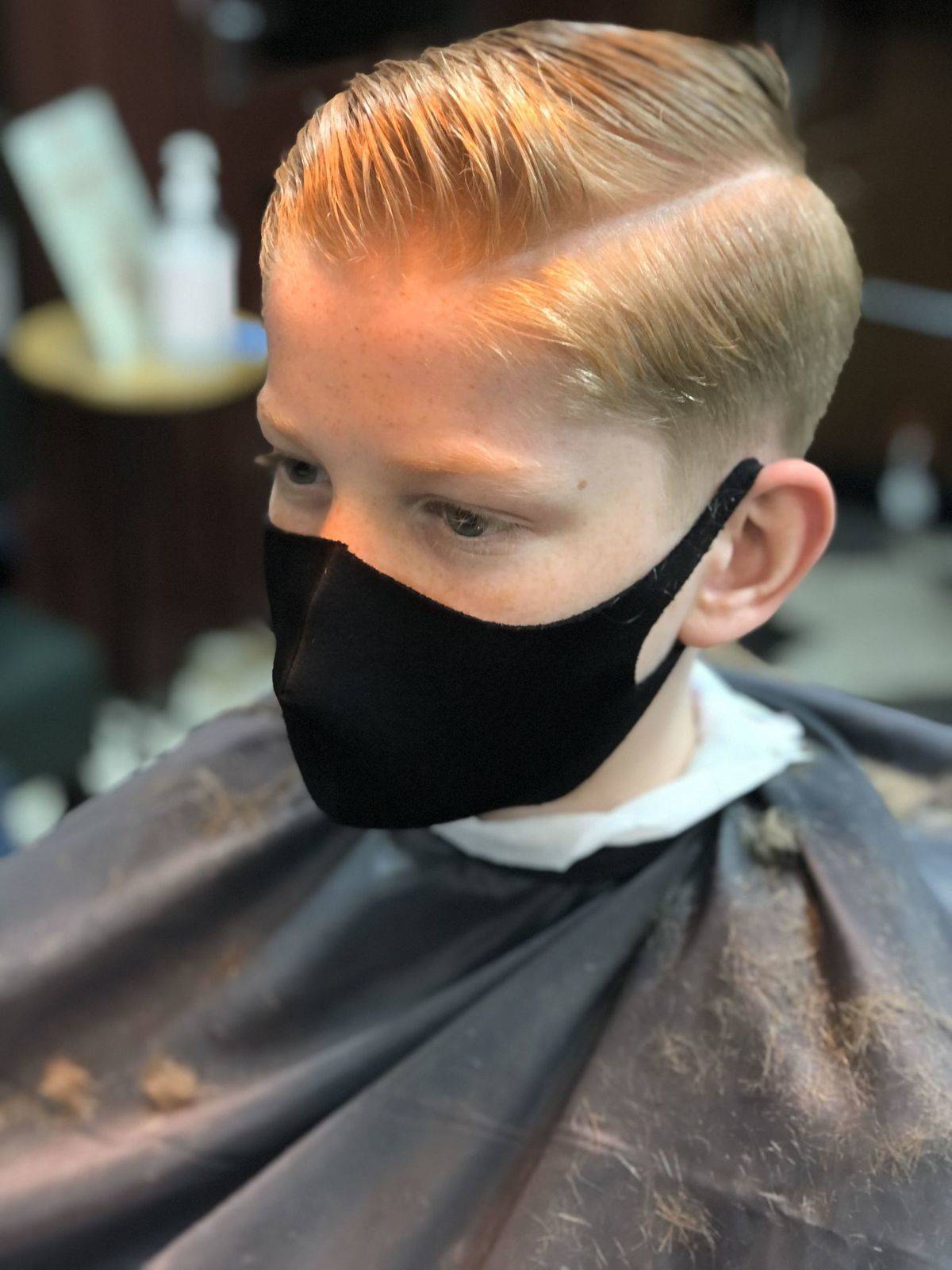 Side line parting haircut for our young customer - currently on trend!