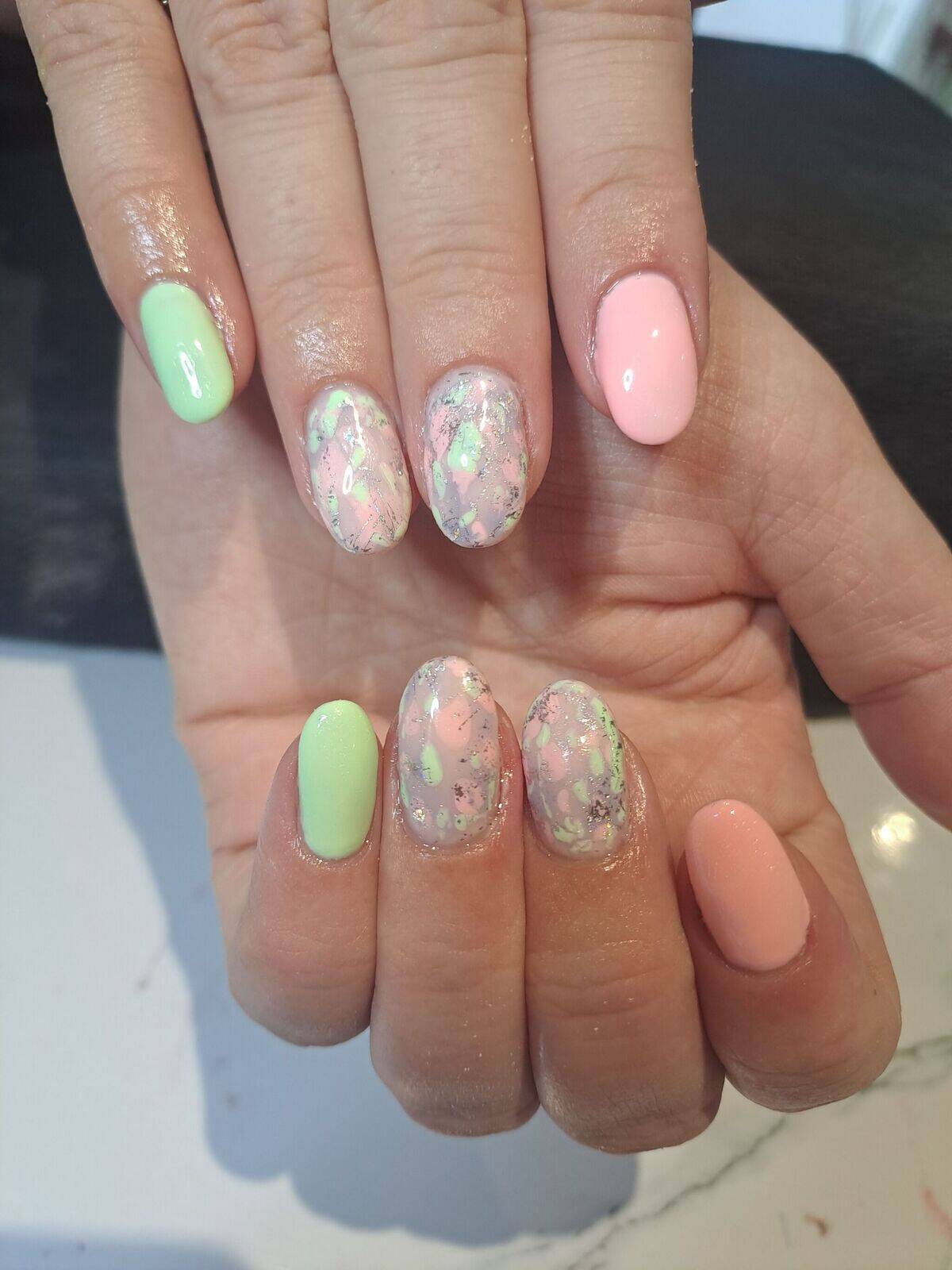 Spring green and pink with a marble design and foil on two fingers