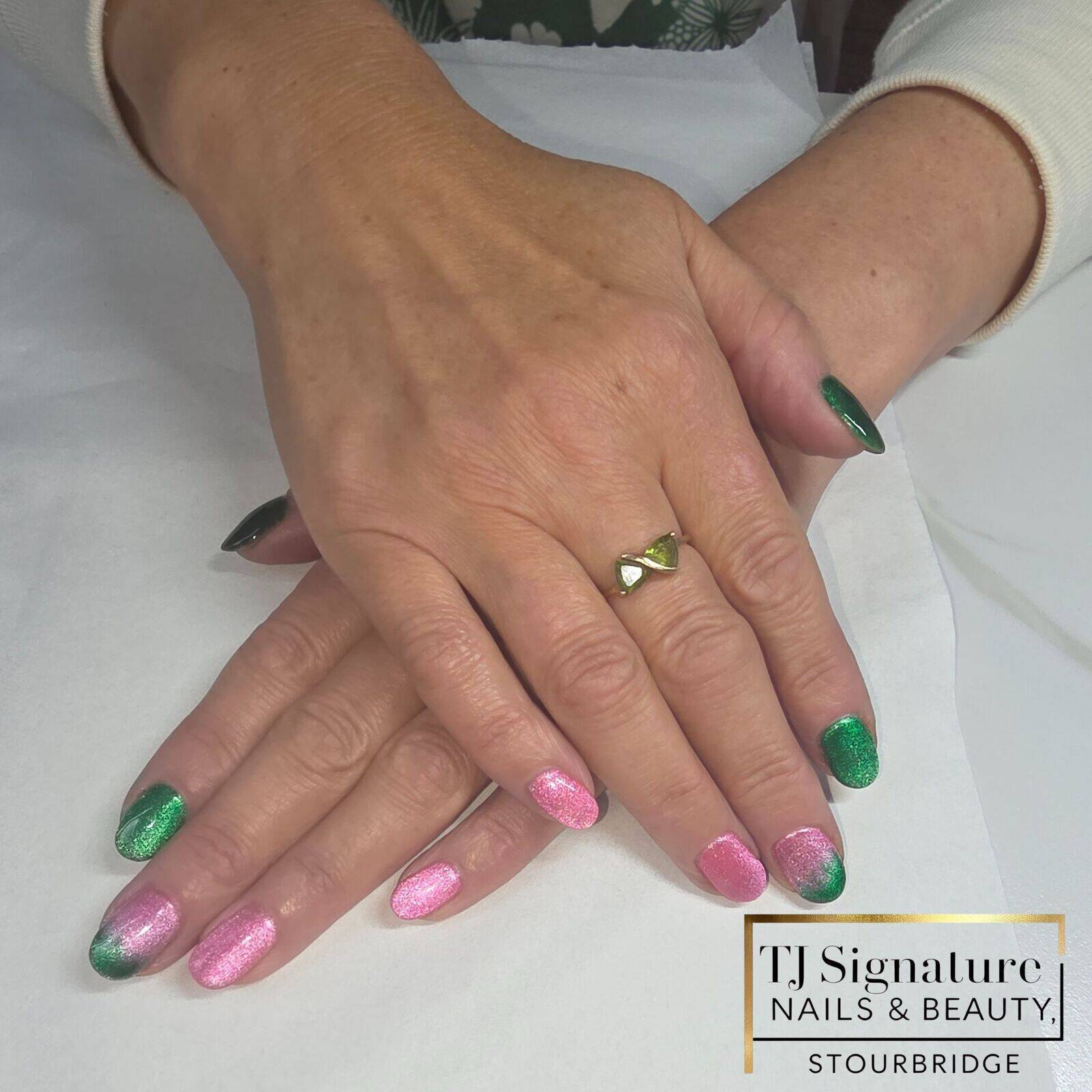 Festive Pink & Green Cat-Eye Builder gel (BIAB) with a shifting festive cat-eye finish and they had matching toes for a full coordinated look.