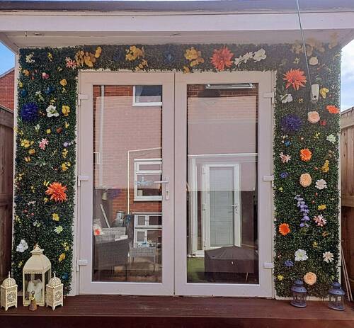 Outside of beauty room complete with flower display