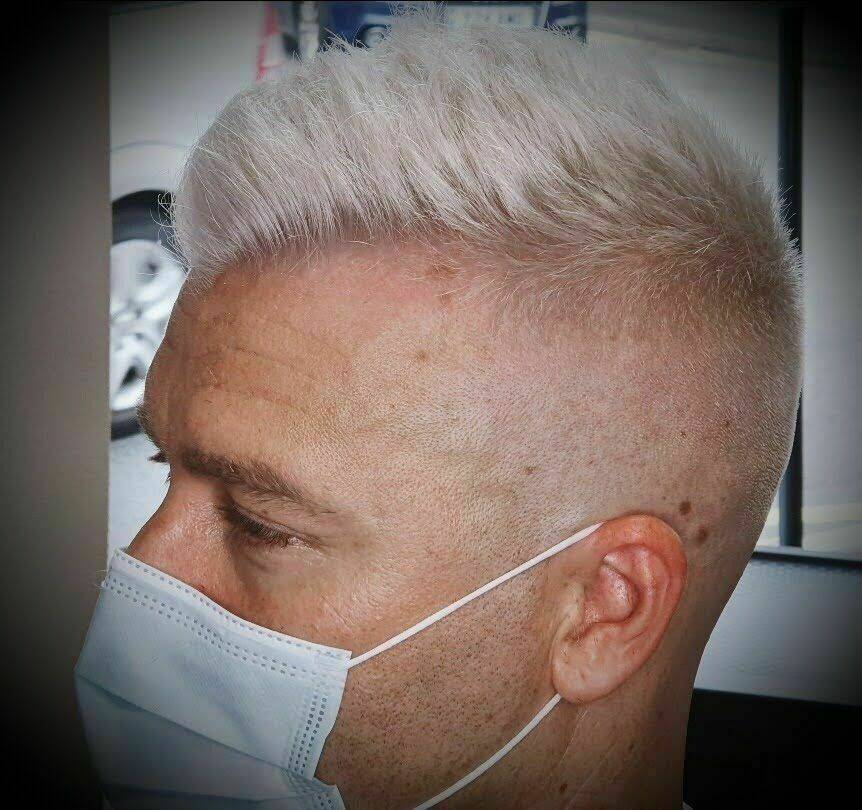 High skin fade with beached top done by Dan and Sharon.