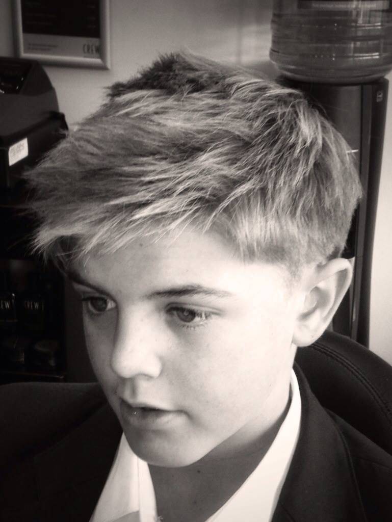 A textured cut broken up mid lengths to emphasise definition...styled using American Crew Fibre