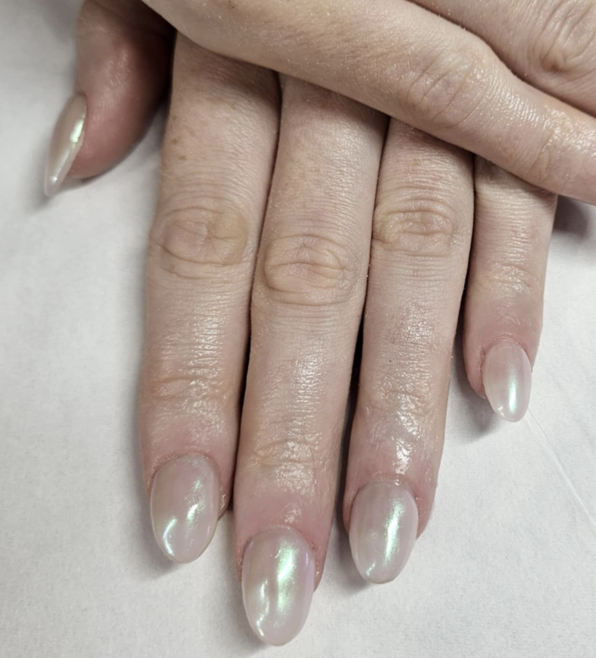 Soft pearl shimmer on a milky base — elegant, timeless acrylics 💅✨