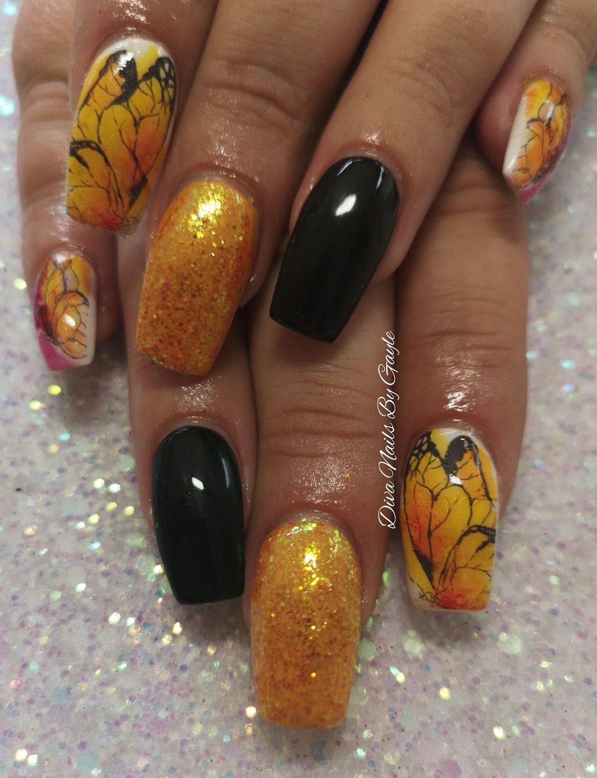 Pretty decals encapsulated in acrylic with marigold glitter