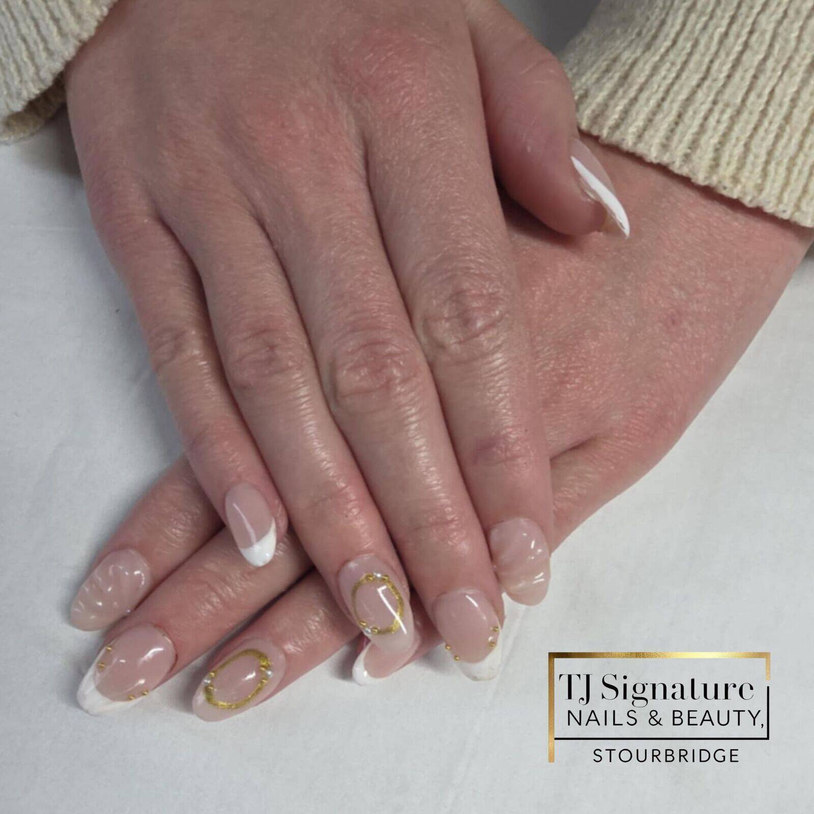 Classic French nails with gold detailing. A timeless, sophisticated design with a luxury twist – perfect for everyday elegance or special occasions.