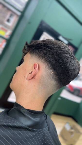 Smooth skin fade with tight transition and crisp detail — crafted by Riz, Master Barber at RYZN Barbers Musselburgh.
