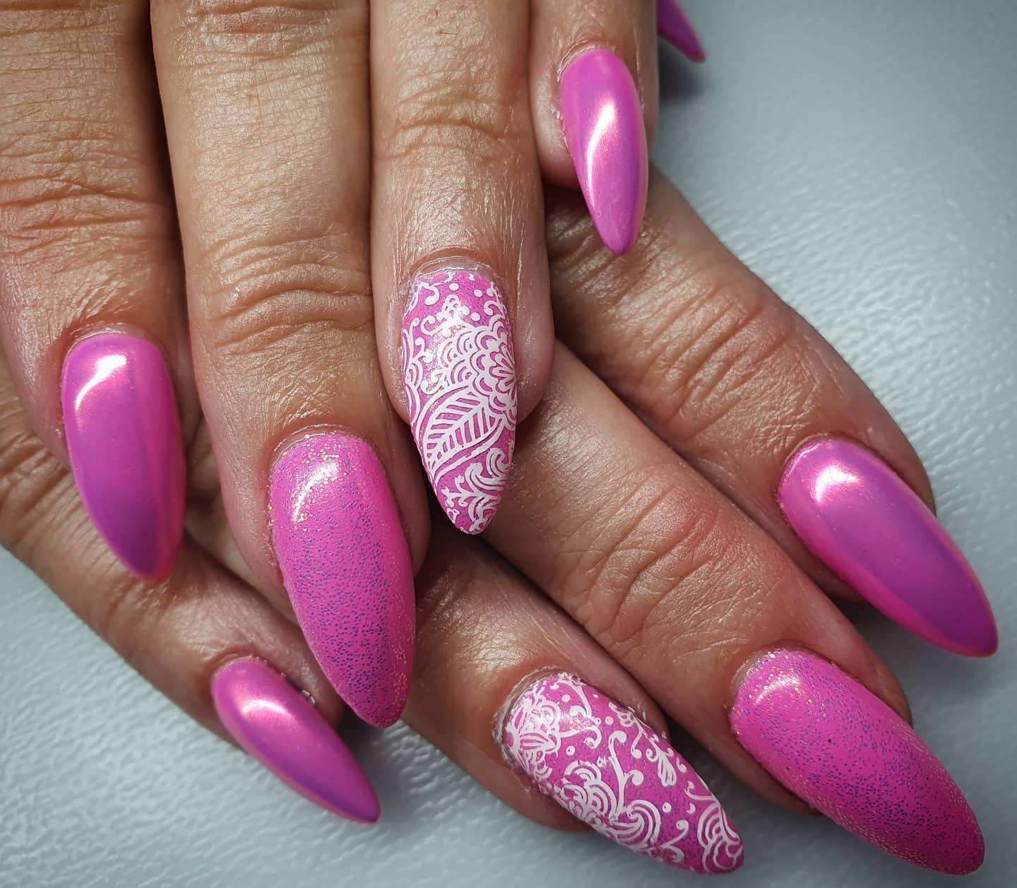 Pretty in pink. Pixie chrome gives a metallic finish that shines orangey-pink. Lovely over warm shades. #chromenails #nailsoftheday #nailextensions #gelnails #pinknails #nailsalon