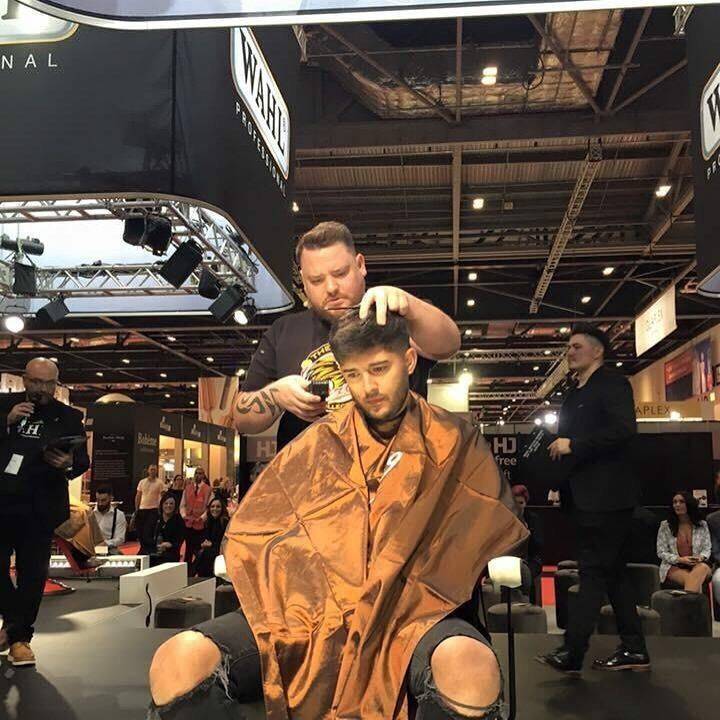 Davie on stage at London British Barber Of The Year runner up 